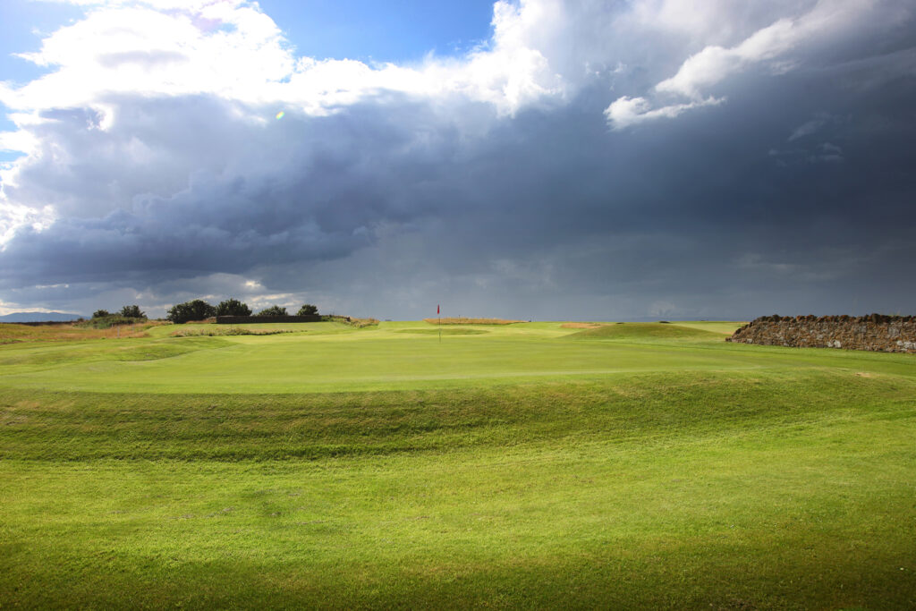 Hole with red flag at Kilspindie Golf Club