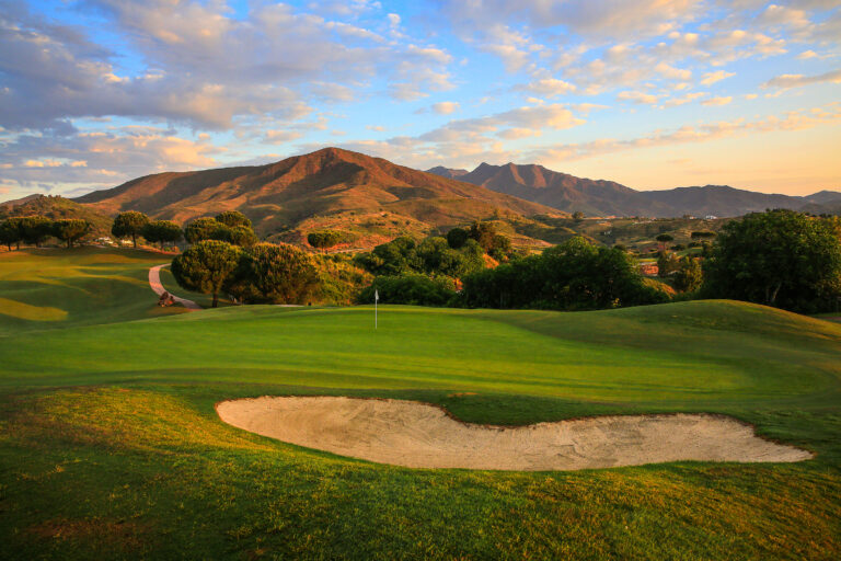 Hole with bunker and hills in background at La Cala - America Golf Course