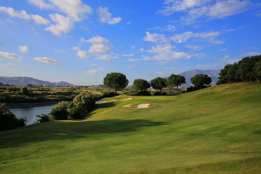 Fairway with bunkers and lake in background at La Cala - America Golf Course