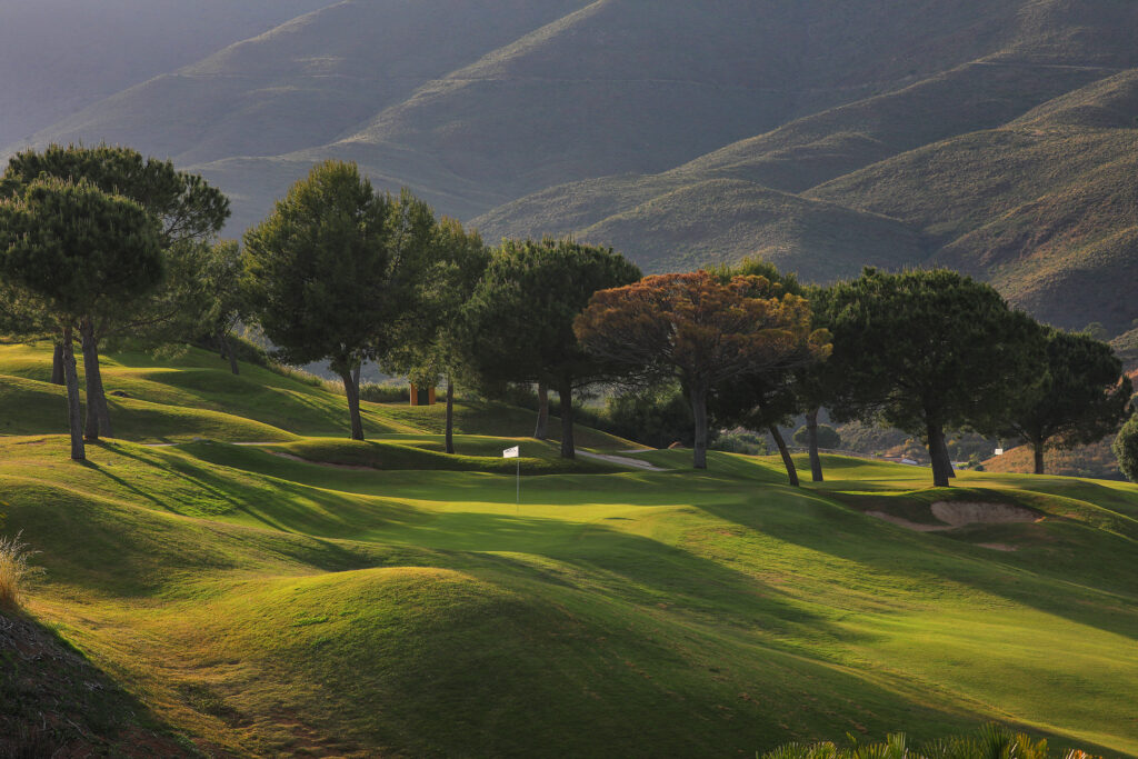 Hole with trees around at La Cala - America Golf Course