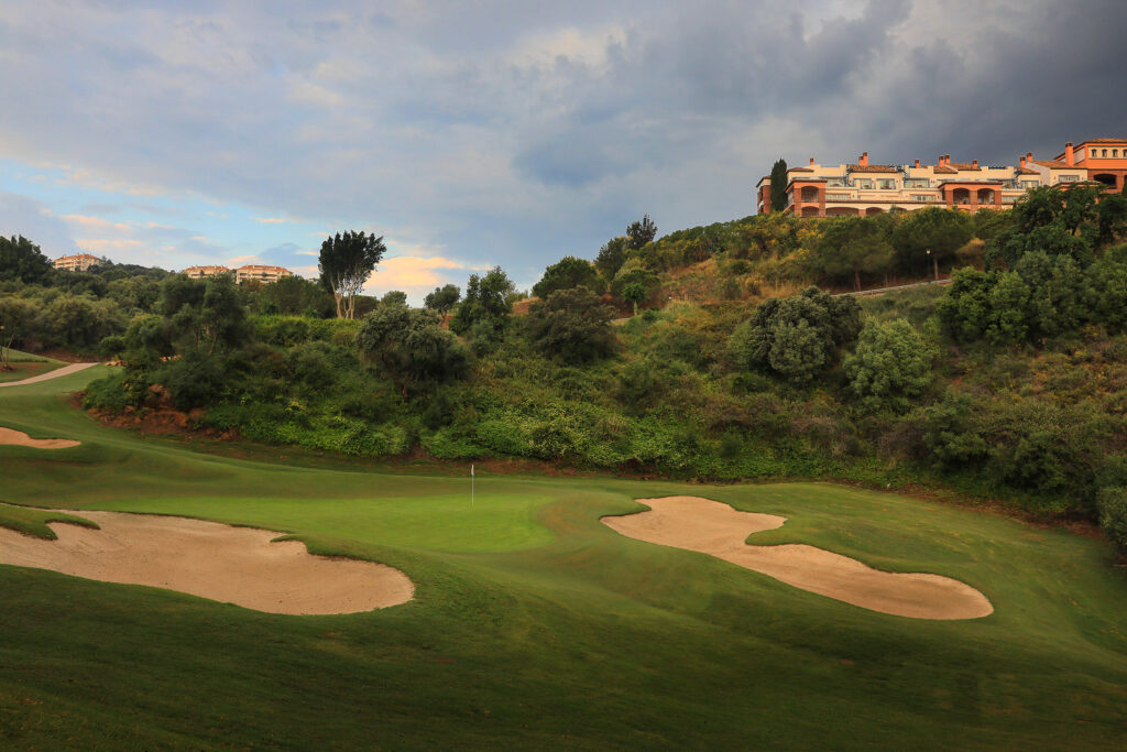 Hole with bunker and trees in background at La Cala - Asia Golf Course