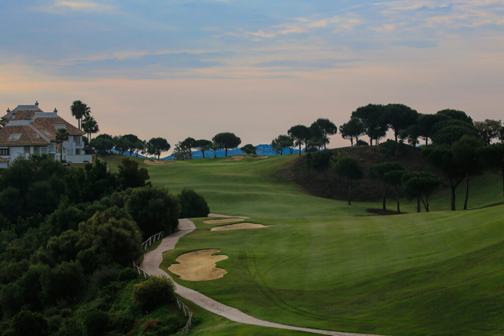 Bunkers on fairway with trees in background at La Cala - Asia Golf Course