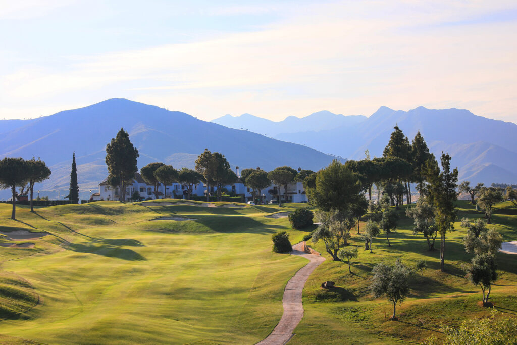 Fairway with trees and hills around at La Cala - Asia Golf Course