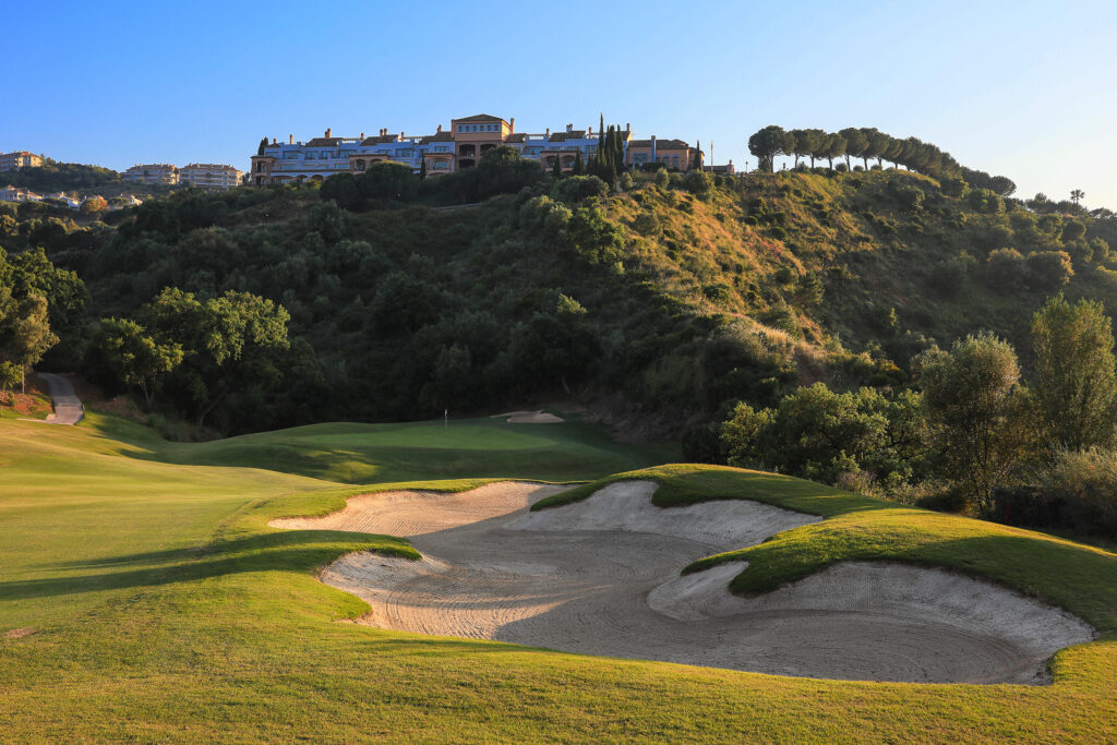 Bunker on fairway with hillside in background at La Cala - Asia Golf Course