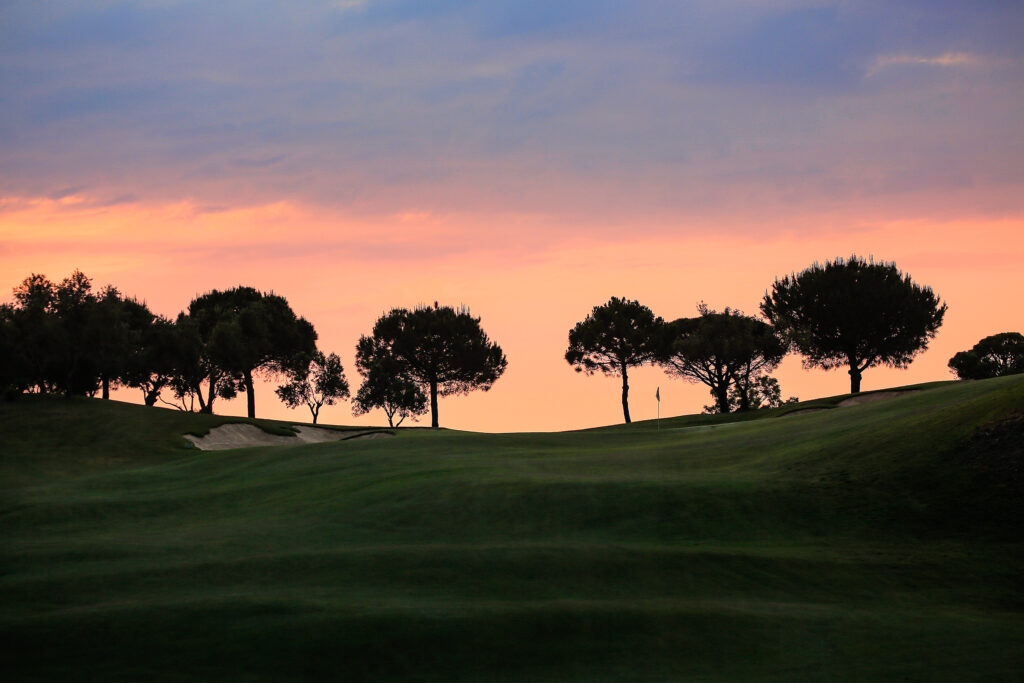 Fairway with trees in background at sunset at La Cala - Asia Golf Course