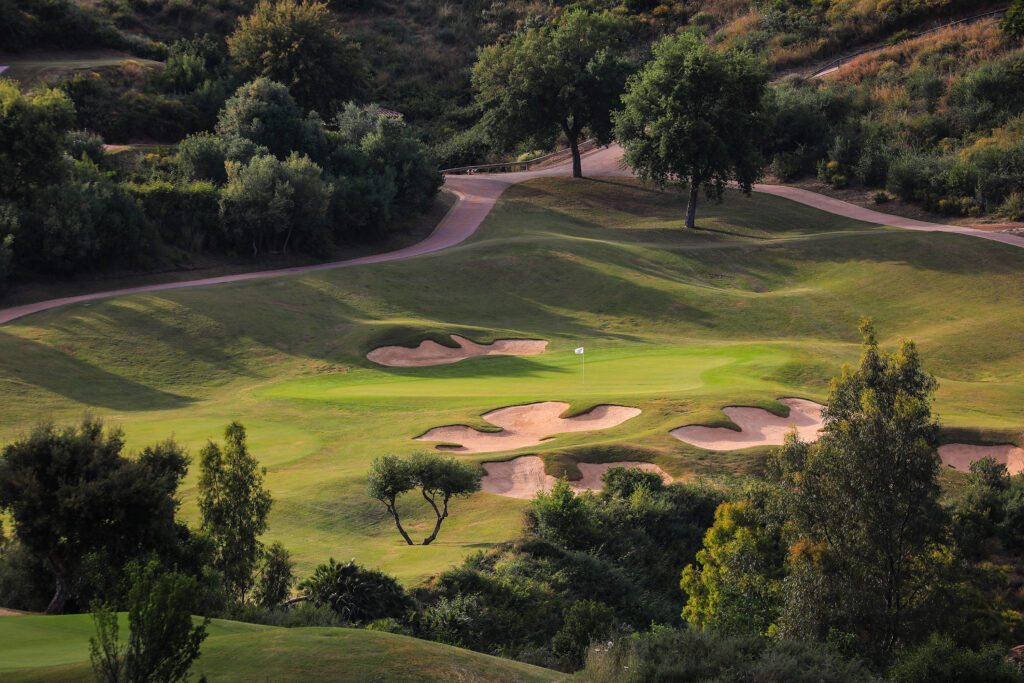 Hole with bunkers and trees around at La Cala - Europa Golf Course