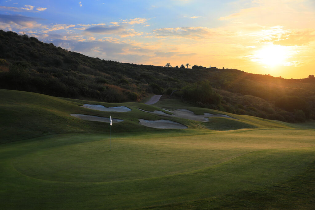 Hole with bunkers and trees around at La Cala - Europa Golf Course