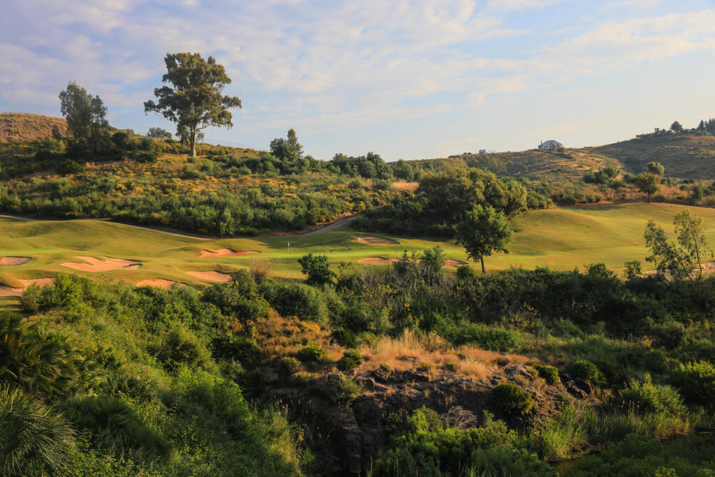 View of fairway with bunkers and trees around at La Cala - Europa Golf Course