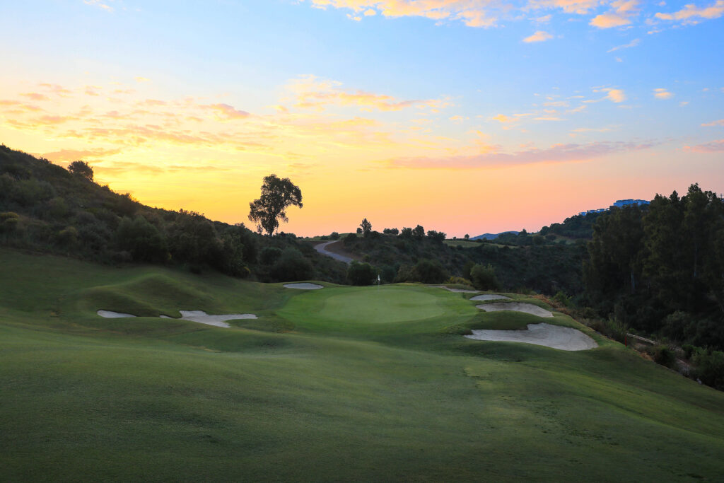 Fairway with bunkers and trees around at La Cala - Europa Golf Course