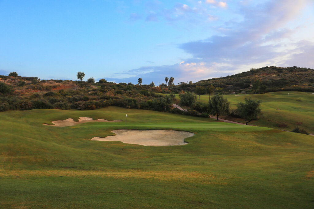 Hole with bunkers and trees around at La Cala - Europa Golf Course