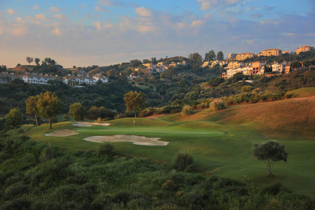 Hole with bunkers and trees around at La Cala - Europa Golf Course