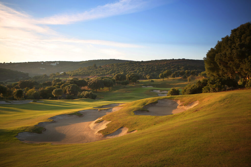 Bunkers on fairway with trees all around at La Reserva de Sotogrande Golf Course