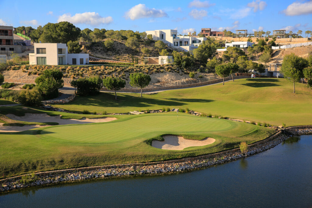 Aerial view of Las Colinas Golf & Country Club with buildings in the background