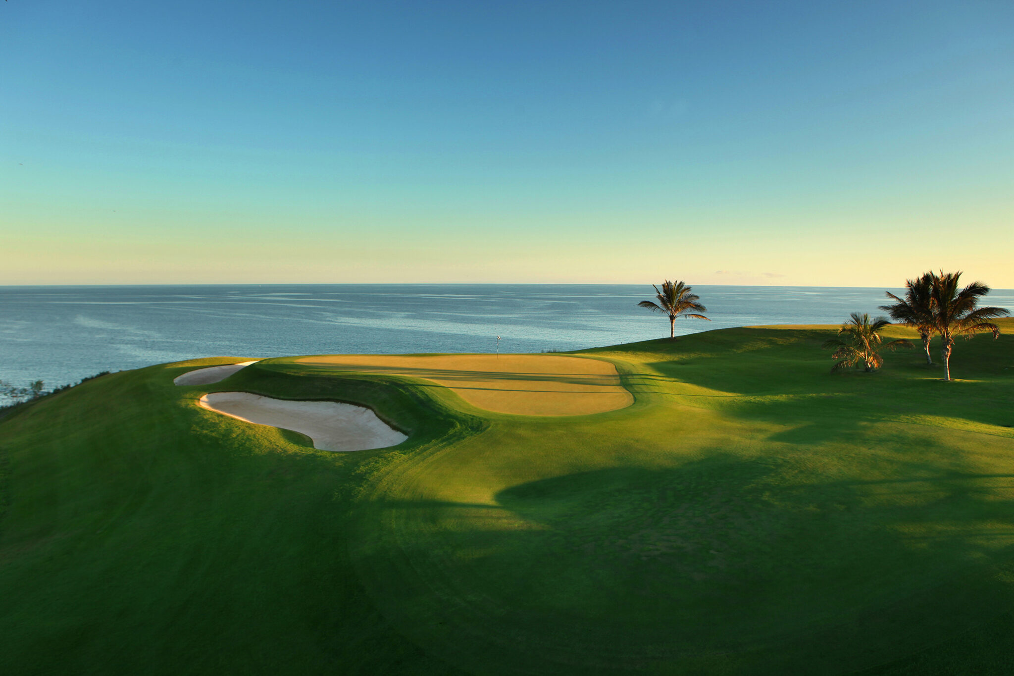 Hole with view of ocean at Meloneras Golf