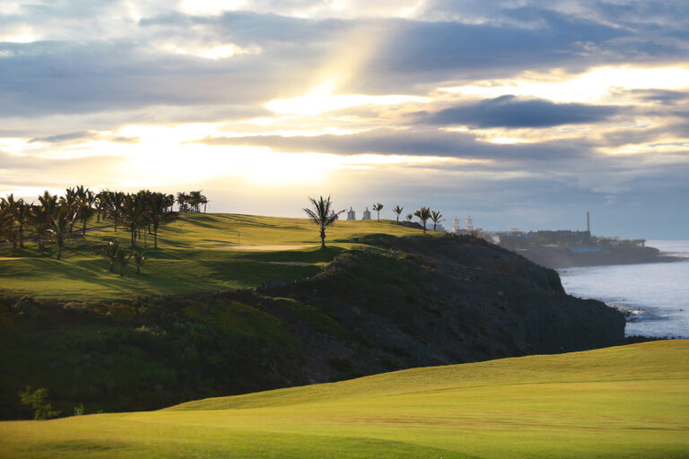 Fairway on clifftop with trees around at Meloneras Golf