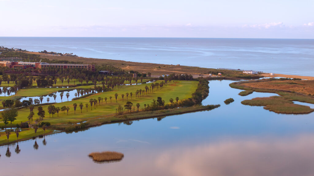 Lake with fairway and beach in the background at Salgados Golf Course