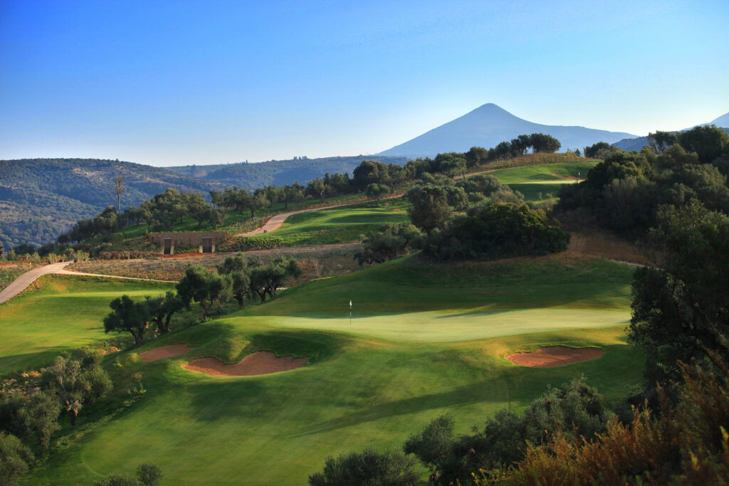 ariel view over the Bay Course with a mountain backdrop