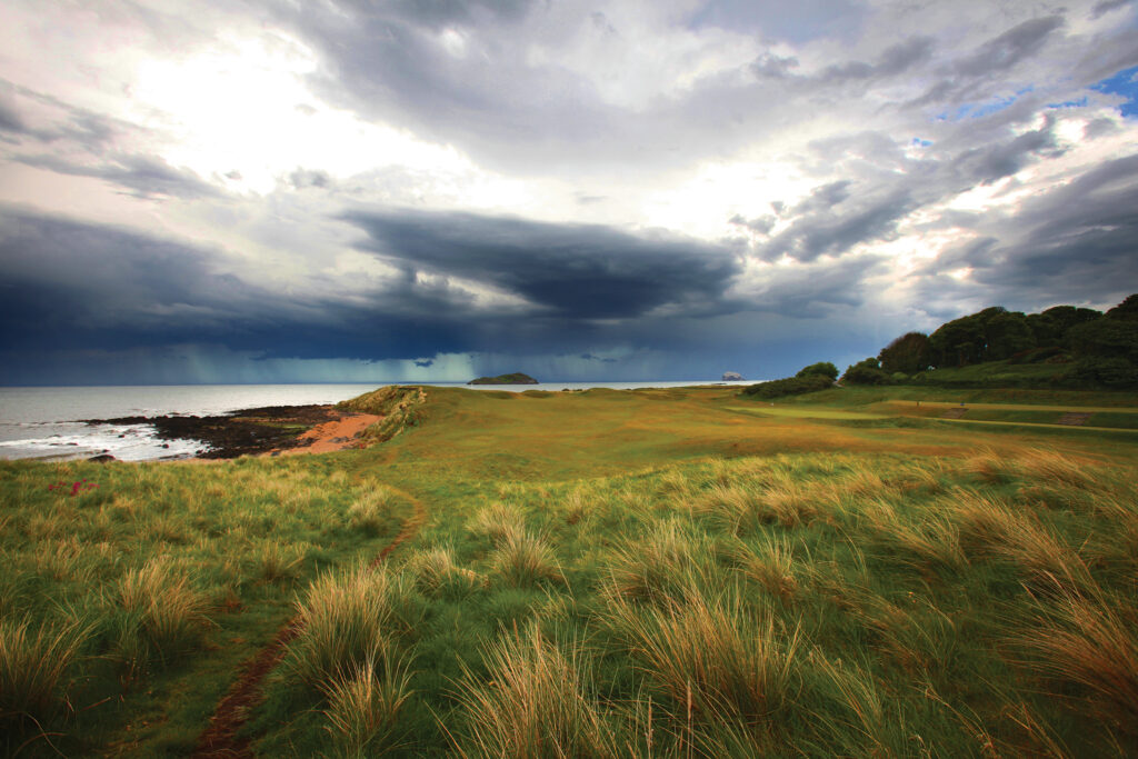 Fairway at North Berwick Golf Club with ocean in background