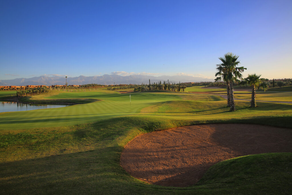 Bunker on fairway at Palm Golf Ourika with trees around