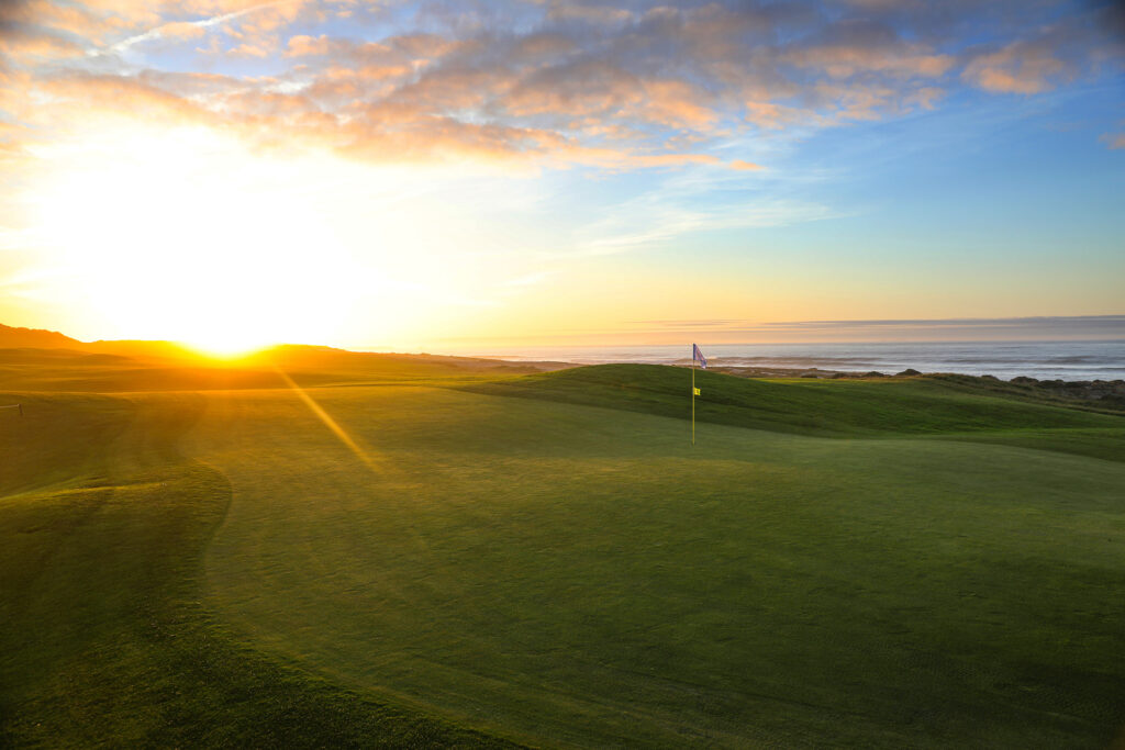 Sun set shining on a hole at Praia d'el Rey Golf Course