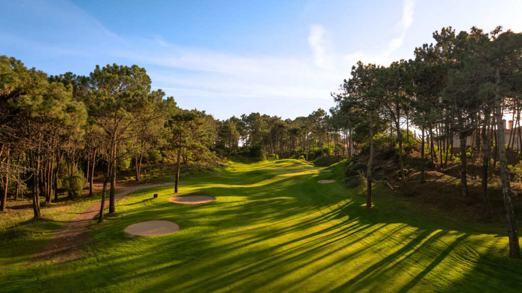 Fairway with bunkers and trees around at Praia d'el Rey Golf Course