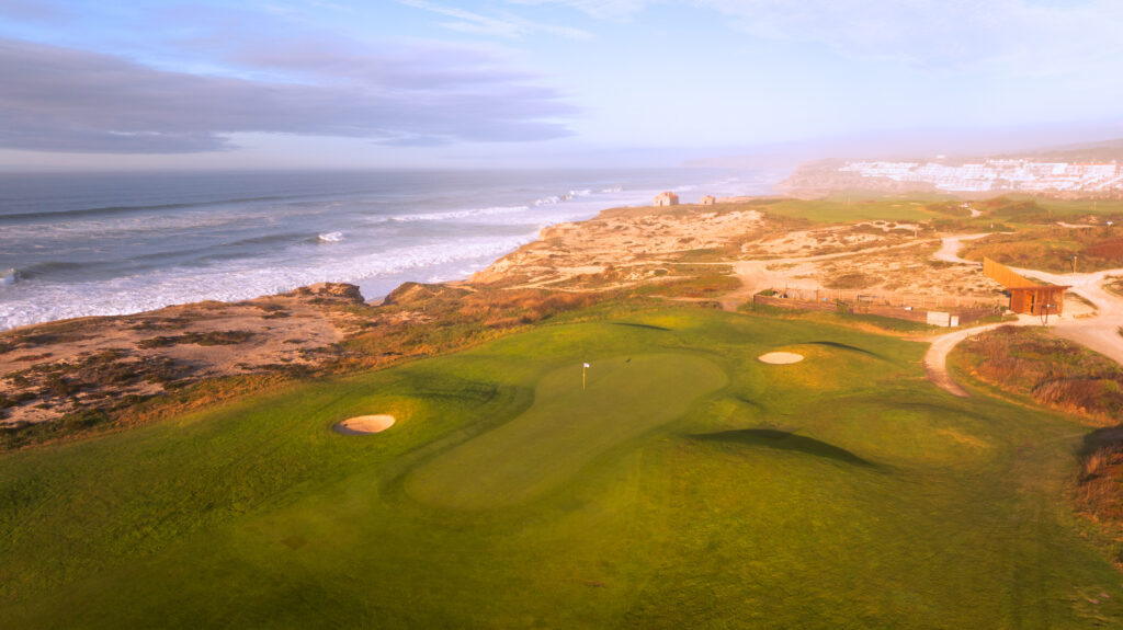 Aerial view of a hole at Praia d'el Rey Golf Course with beach view