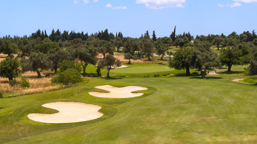 The fairway with bunkers and trees around at Quinta De Cima Golf Course