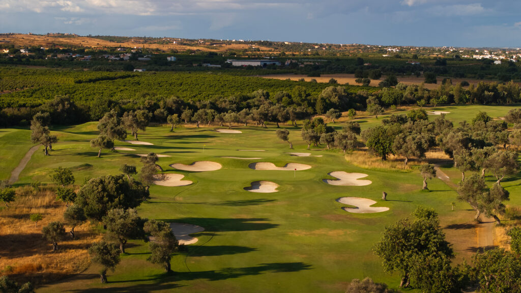 Aerial view of fairway with multiple bunkers at Quinta De Cima Golf Course with trees surrounding