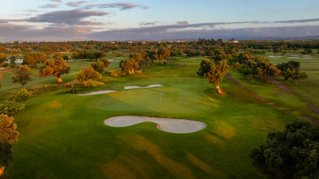 A green with three bunkers around it at Quinta De Cima Golf Course