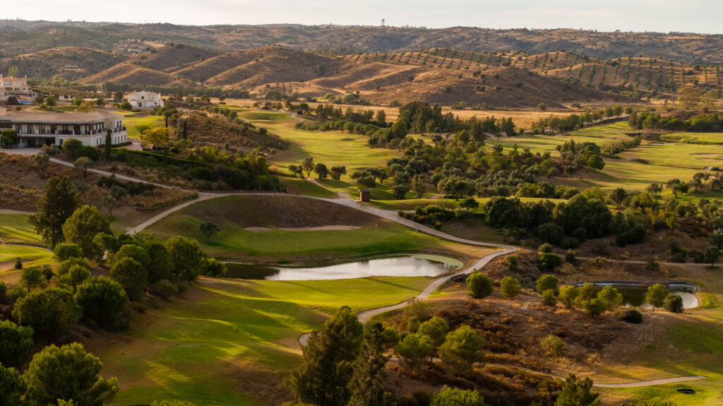 Aerial view of Quinta do Vale Golf Course with hills in background