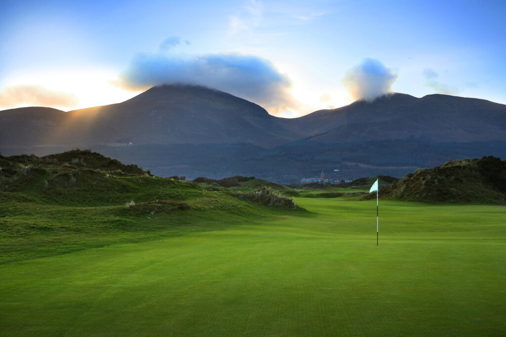 Hole at Annesley Links at Royal County Down with hills in background