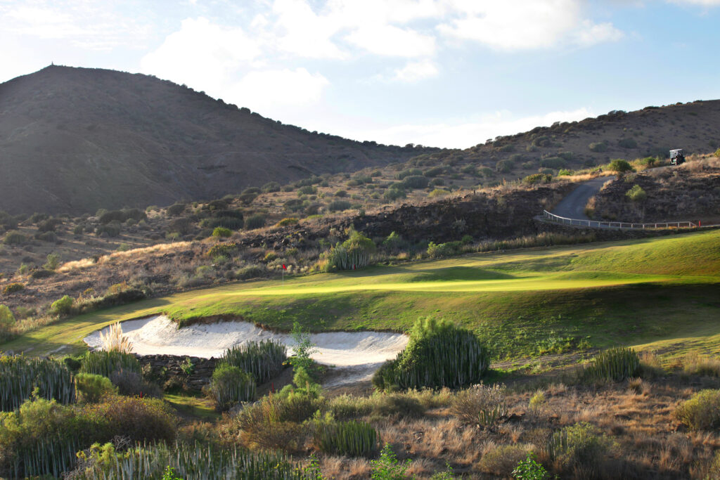 Hole with bunker and hill in background at Salobre Golf - New Course