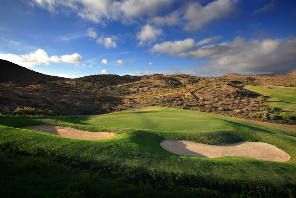 Hole with bunkers and hills in background at Salobre Golf - New Course