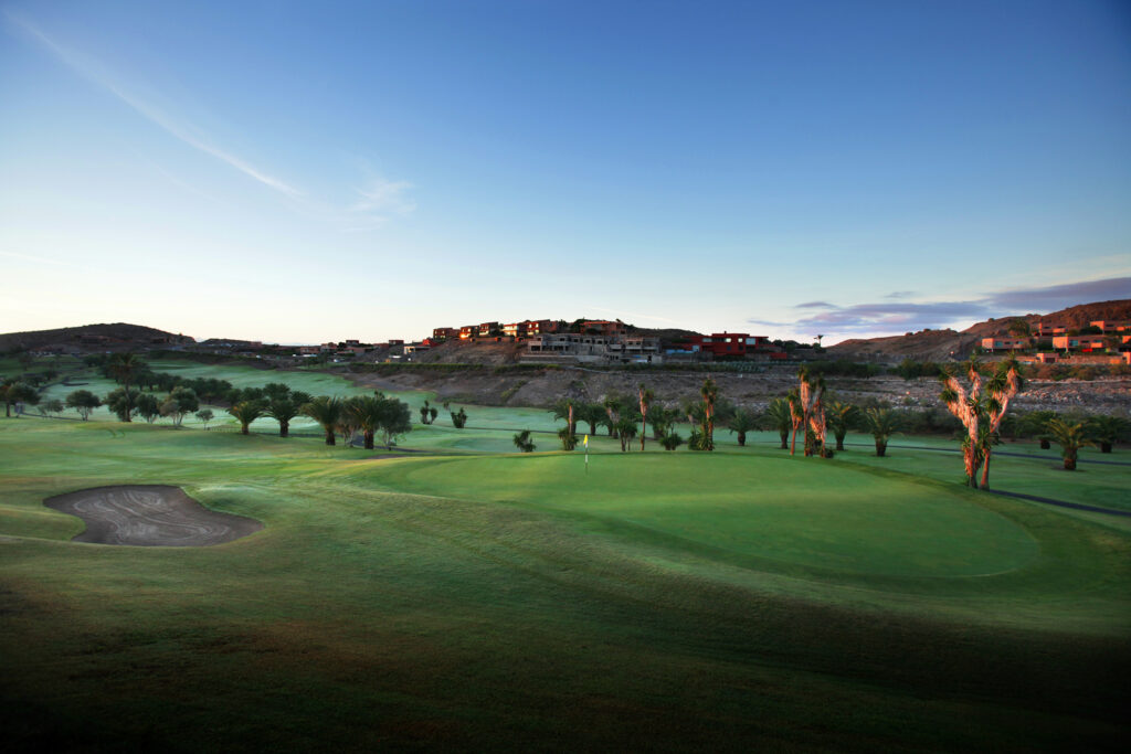 A hole with bunker and trees around at Salobre Golf - Old Course