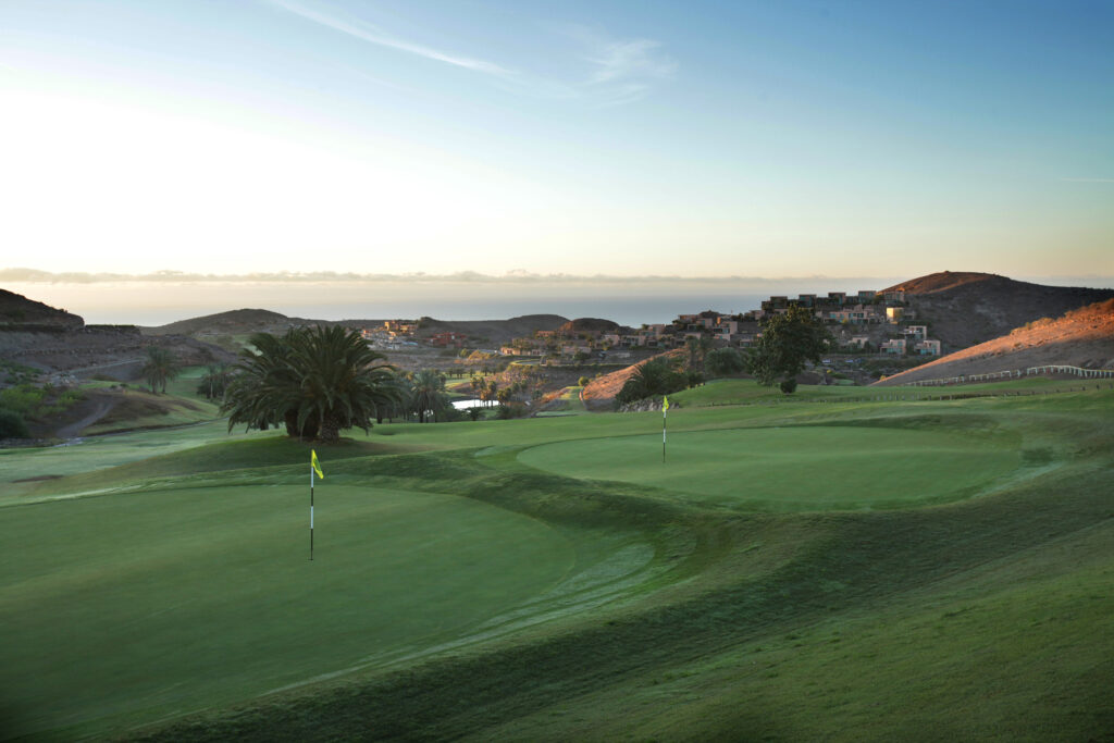 Holes at Salobre Golf - Old Course with buildings in background