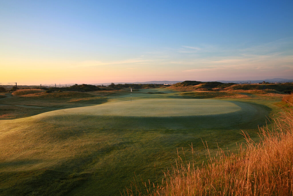 Hole with white flag at The Castle Course at St Andrews