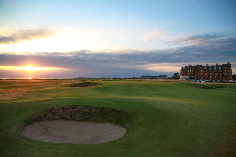 Bunkers on fairway at The Castle Course at St Andrews with building in background