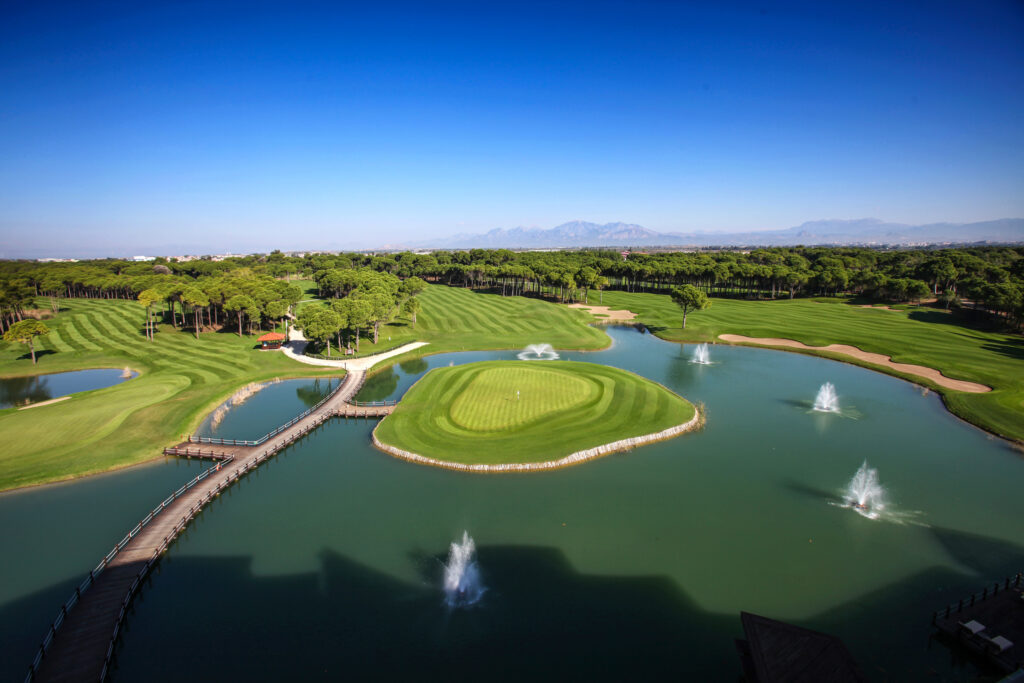 Aerial view of lake on fairway at Sueno Golf Club - Dunes Course