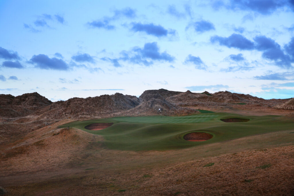 Hole with bunkers at Trump International Golf Links with mounds around