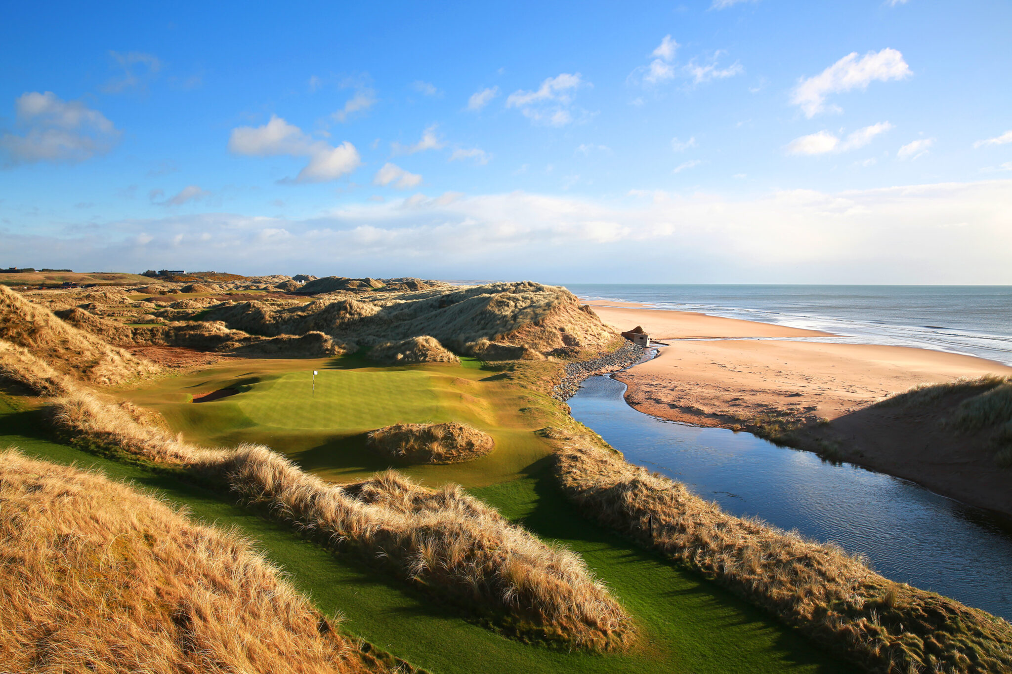 Aerial view of Fairway at Trump International Golf Links next to beach