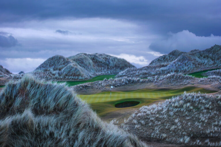 Hole surrounded by mounds at Trump International Golf Links