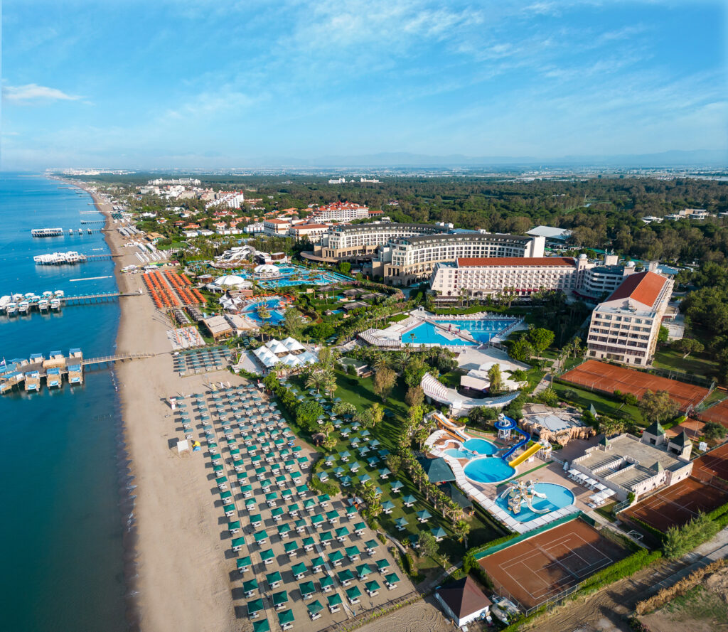 Aerial view of Kaya Belek Hotel with beach and loungers