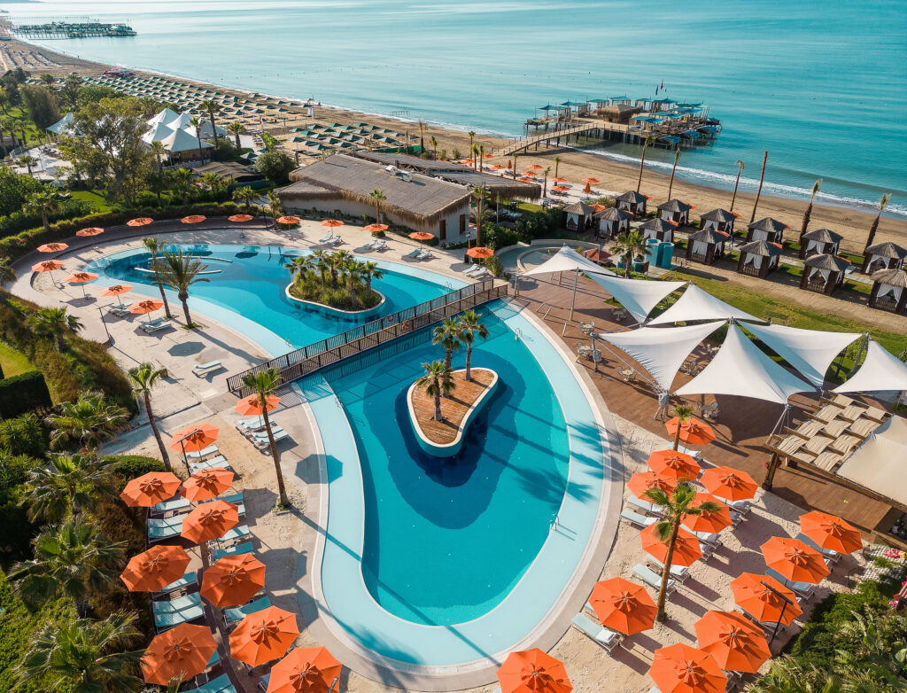 Aerial view of outdoor pool with beach view at Kaya Palazzo Golf Resort