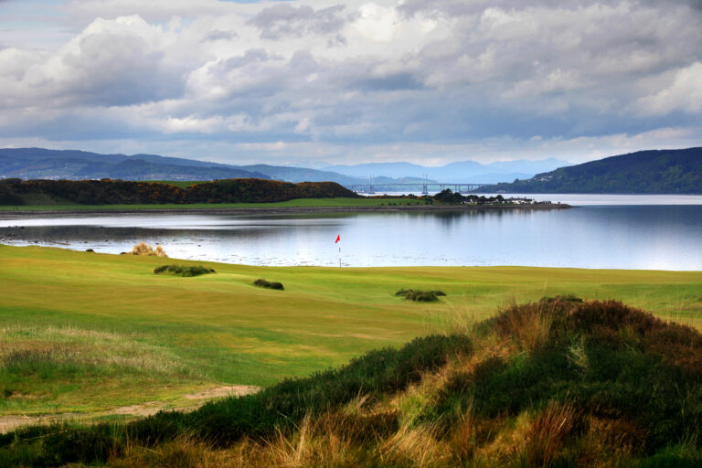 Hole with lake in background at Castle Stuart Golf Links