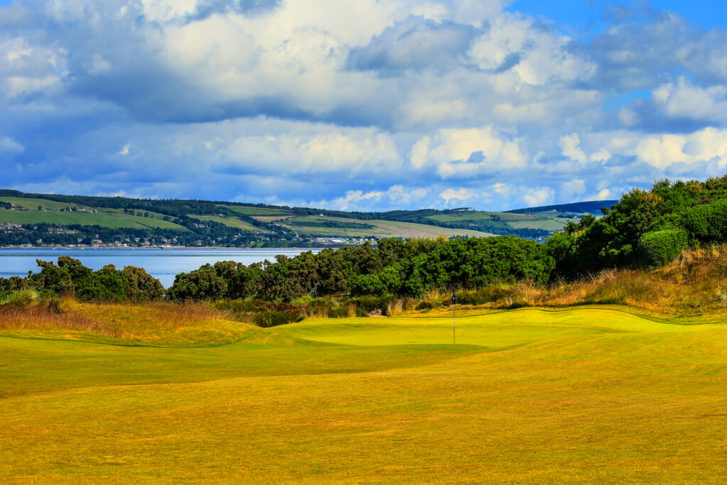 Hole with ocean in distance at Castle Stuart Golf Links