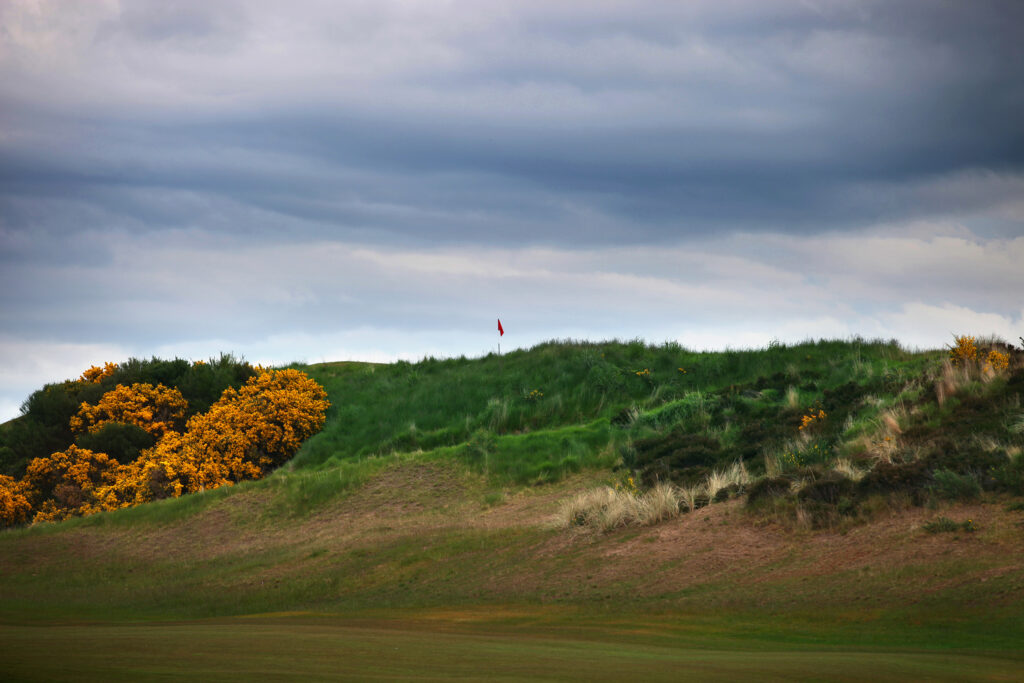 Mound with hole on top at Castle Stuart Golf Links