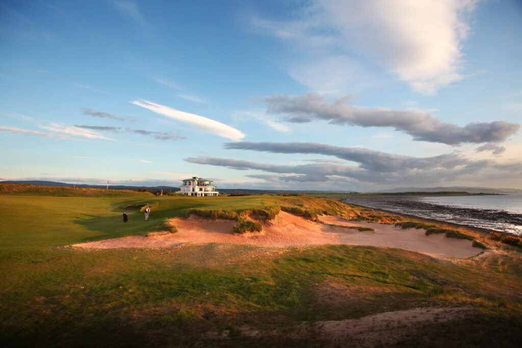 Bunker on fairway at Castle Stuart Golf Links with ocean view