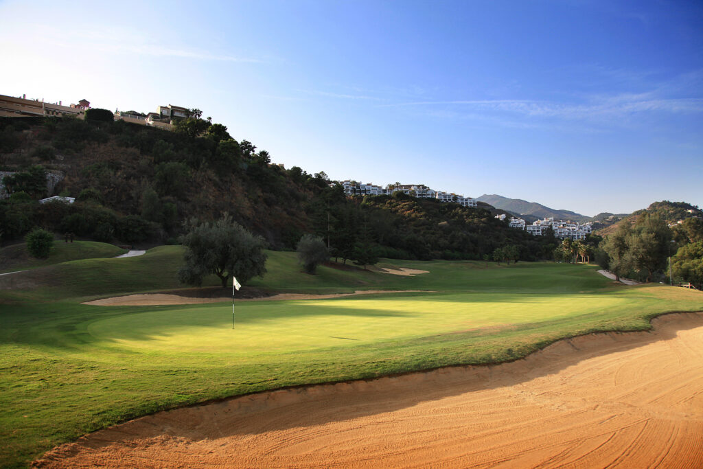 Hole with bunker and trees around at La Quinta Golf Course