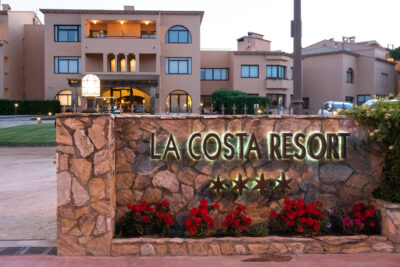 Exterior of La Costa Golf & Beach Resort with sign