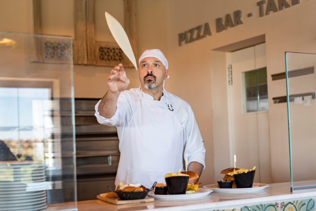 Chef making pizza at La Finca Resort